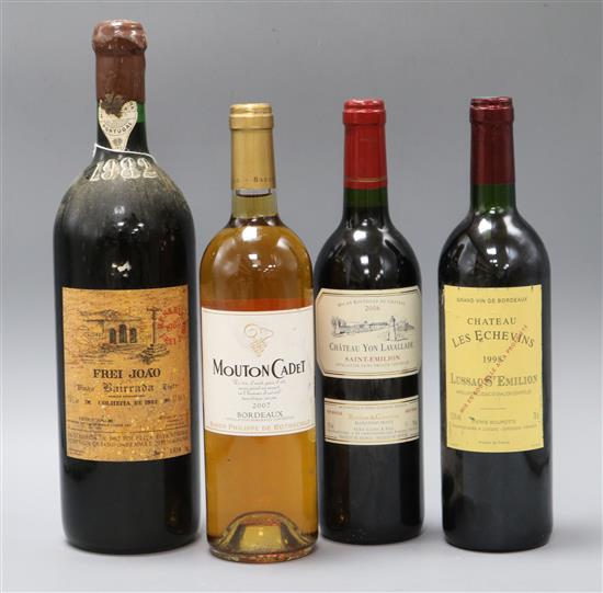 A bottle of Frei Joao, Bairrada 1982 and three other bottles of wine
